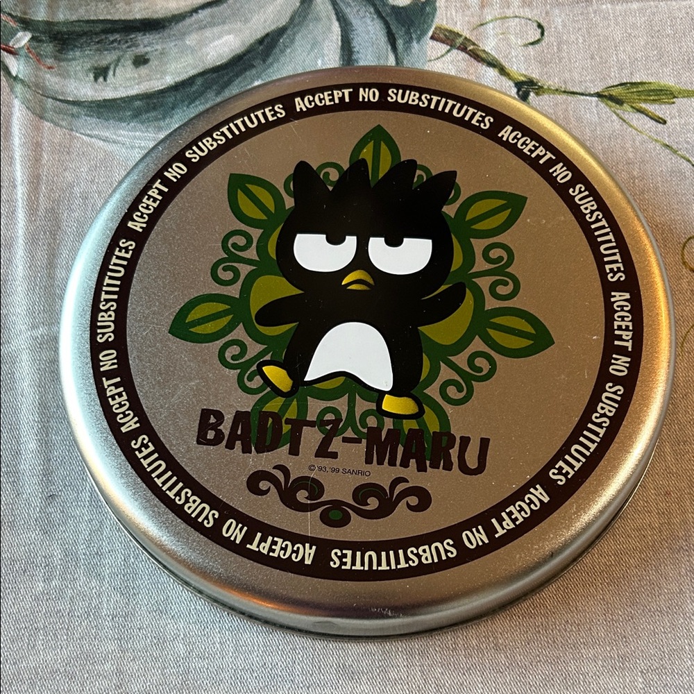 Sanrio Badtz-Maru metal storage tin, also described as a coin or wall bank. EUC